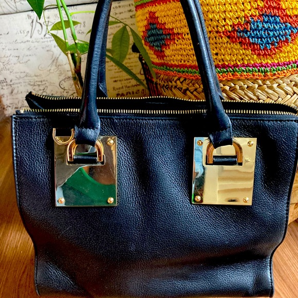 Danier Sage" metal black leather satchel with gold trimmings - Picture 9 of 16